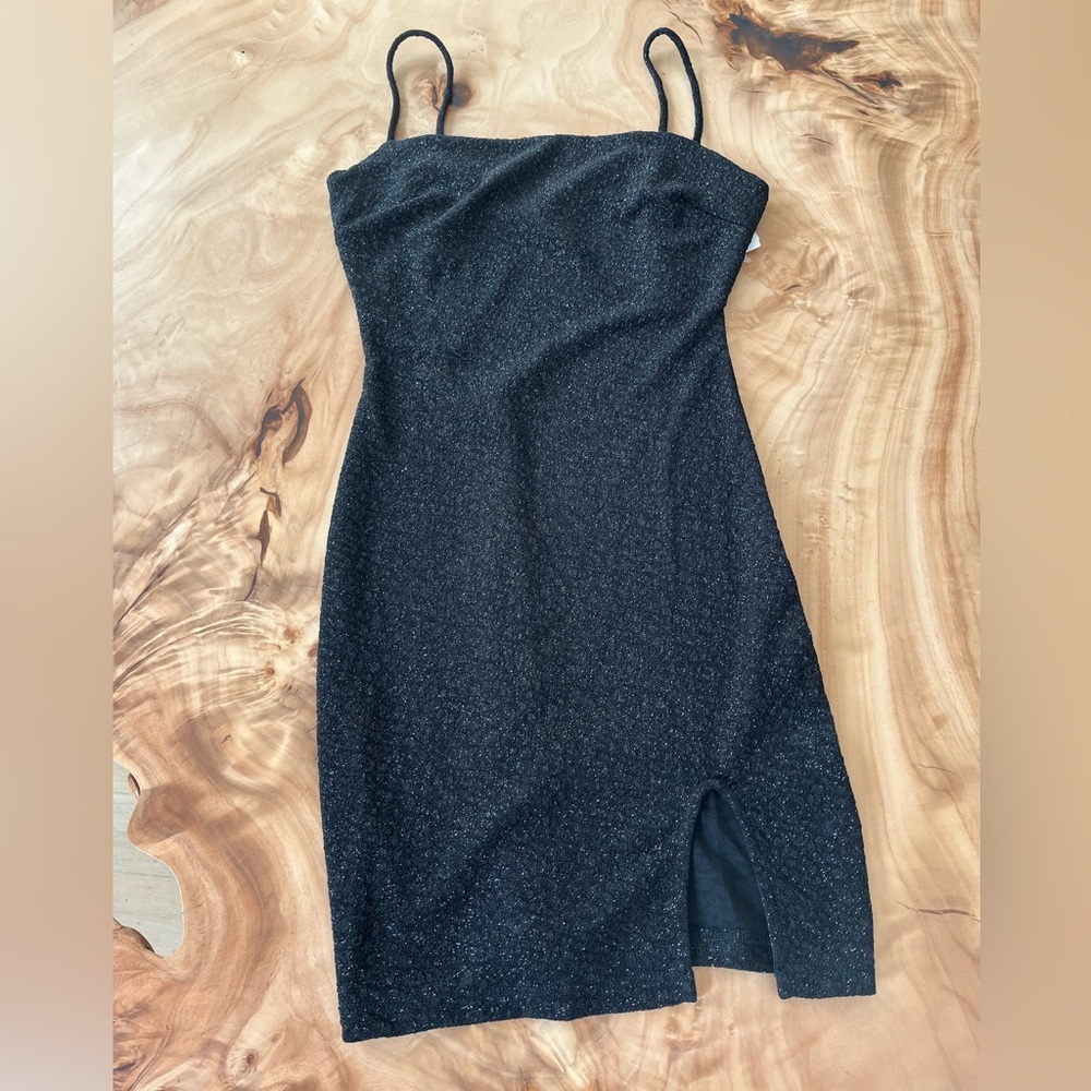 Black sparkly mini dress with small slit